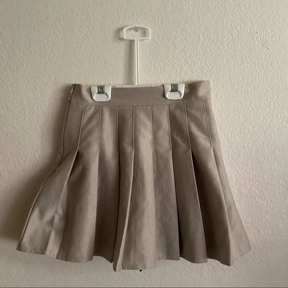 beige pleated mini skirt